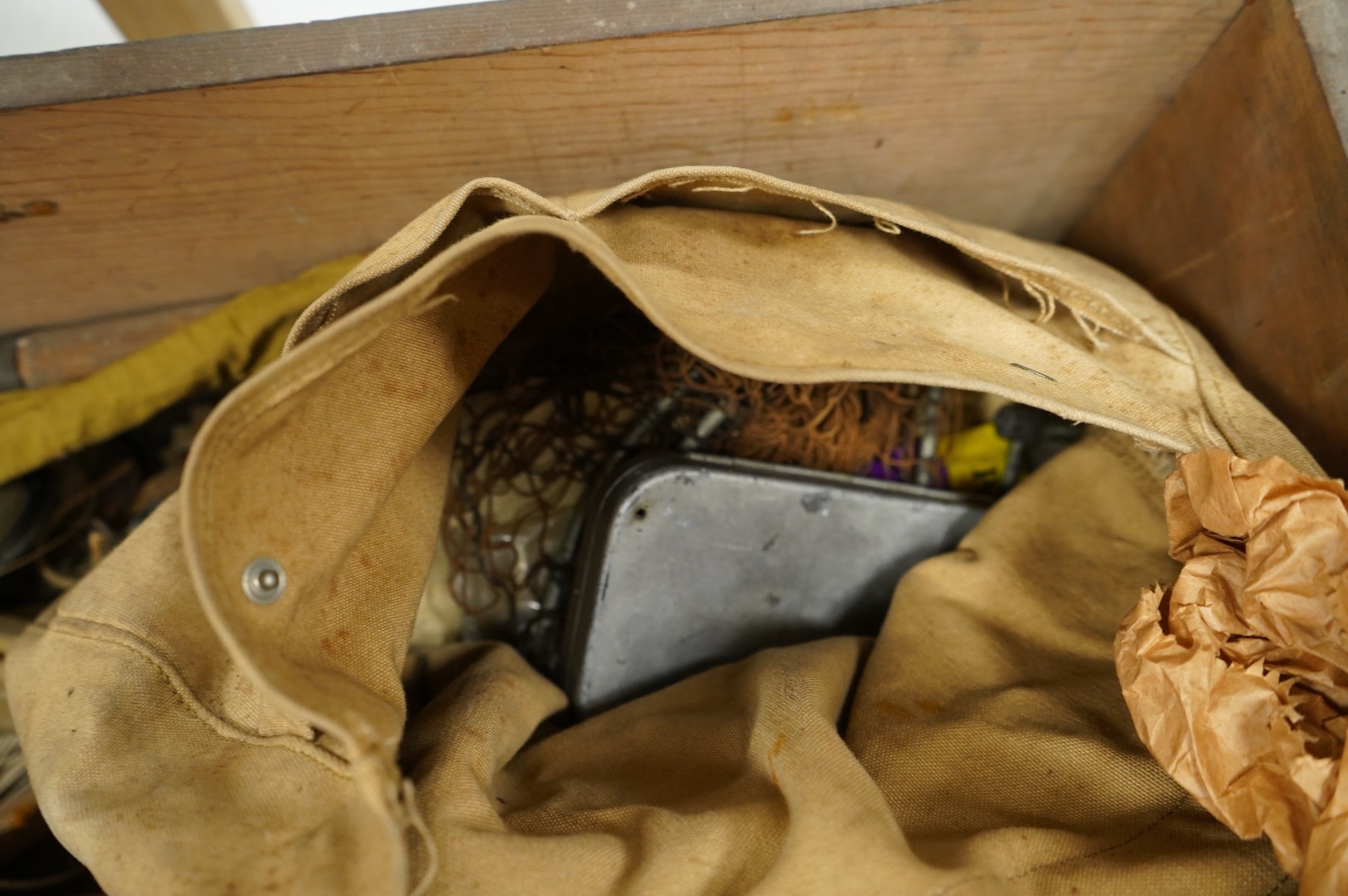 A collection of split cane fishing rods, reels, landing net etc contained in a large wooden box